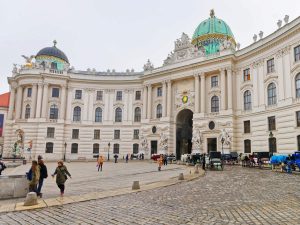 People at St Michael Wing of Hofburg Palace in Vienna