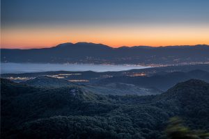 Landscape of mountains covered in greenery in Rijeka and Opatija during the sunrise in Croatia