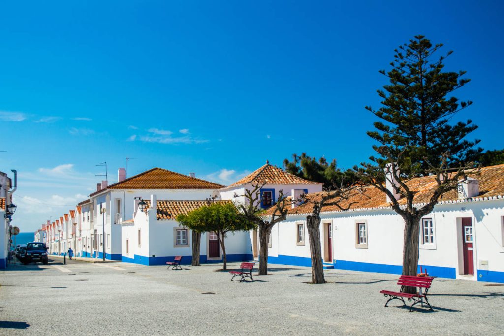 Traditional blue and white Alentejo Portuguese buildings in Porto Covo, Portugal